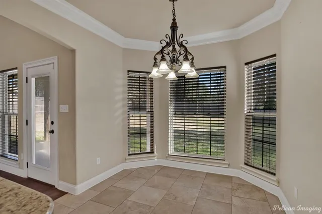 a view of empty room with windows