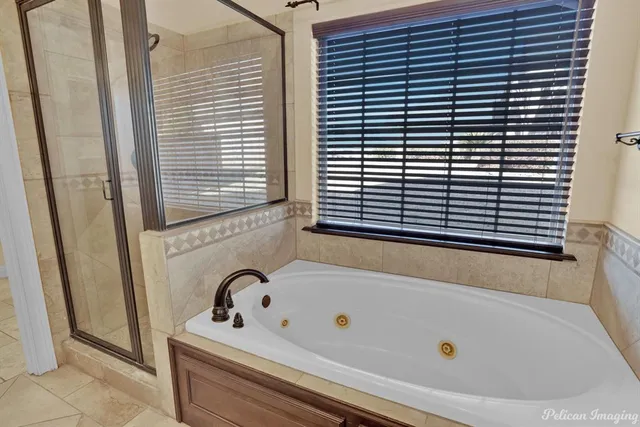 a bathroom with a bathtub and a window