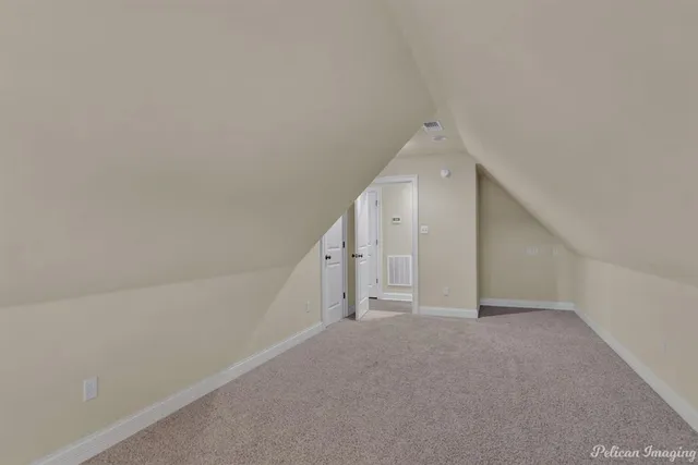 a view of a big room with closet and windows