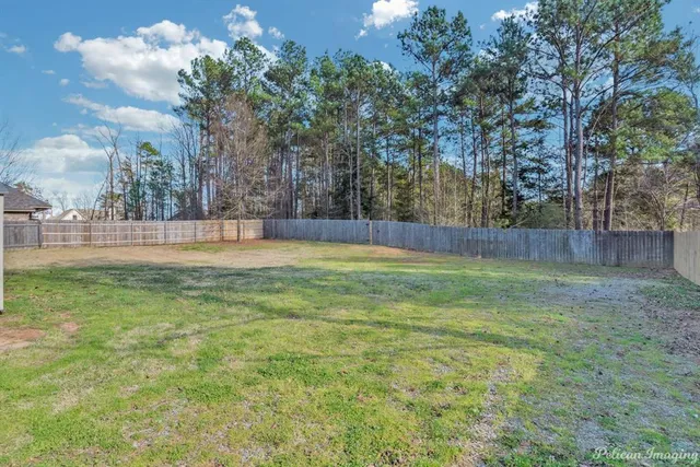 a view of outdoor space with trees all around
