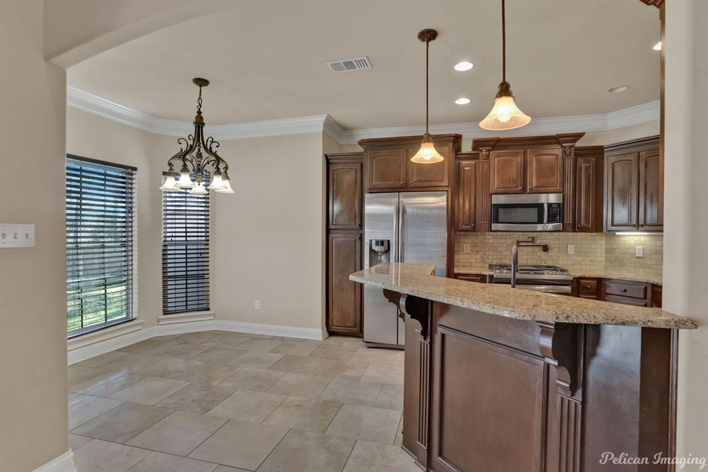 2805 Clearbrook Way Haughton, LA 71037 - Photo 10 of 36 a view of a kitchen with a sink and chandelier