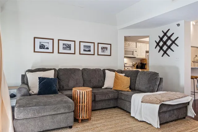 a living room with a couch and a window