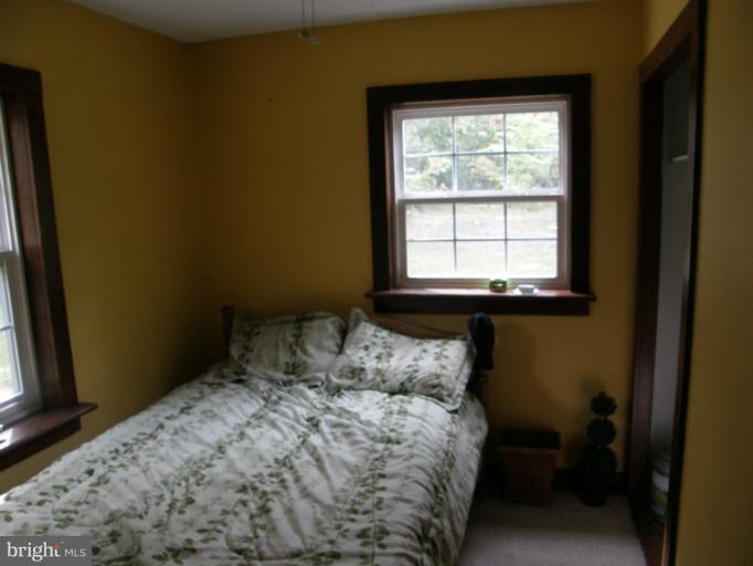 6885 Harmony Road Preston, MD 21655 - Photo 21 of 22 a bedroom with a bed and a window