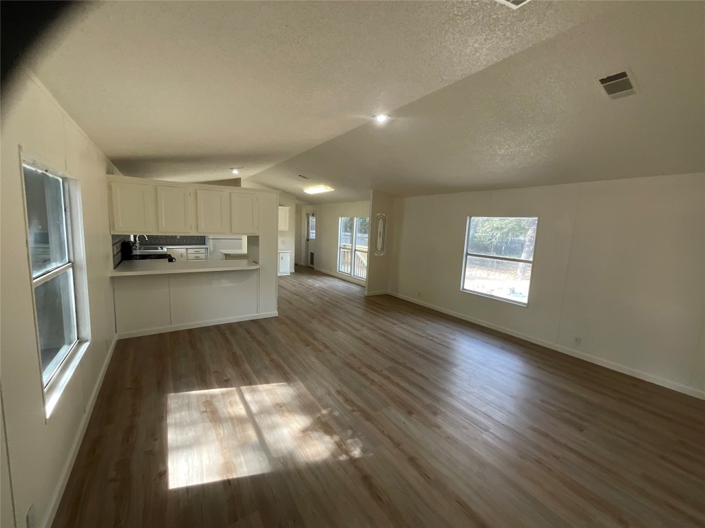 204 Overhill Road Bastrop, TX 78602 - Photo 13 of 18 a kitchen with stainless steel appliances granite countertop a refrigerator sink and cabinets