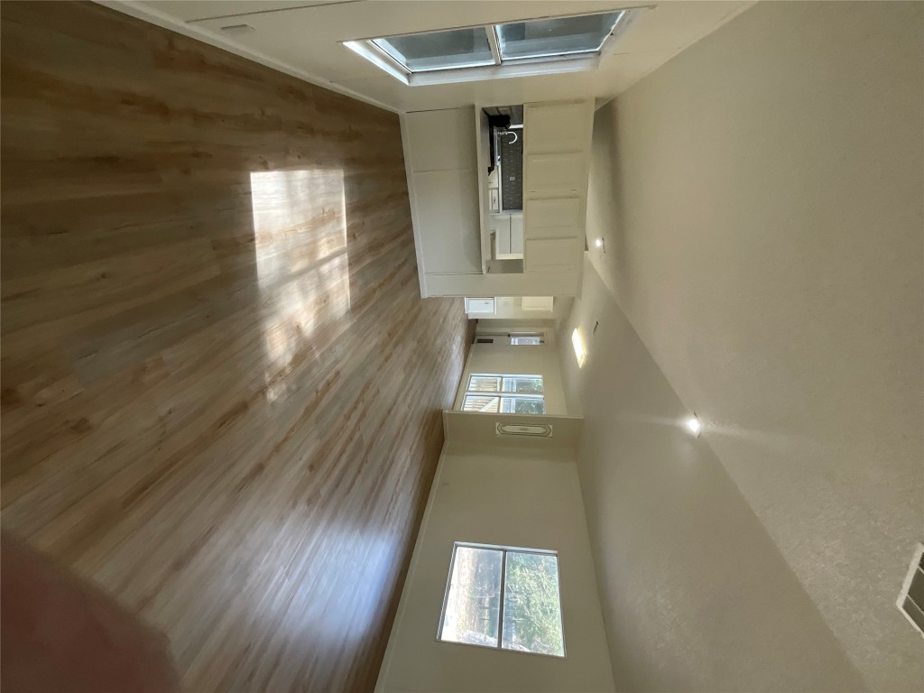 204 Overhill Road Bastrop, TX 78602 - Photo 14 of 18 a view of a kitchen cabinets and wooden floor