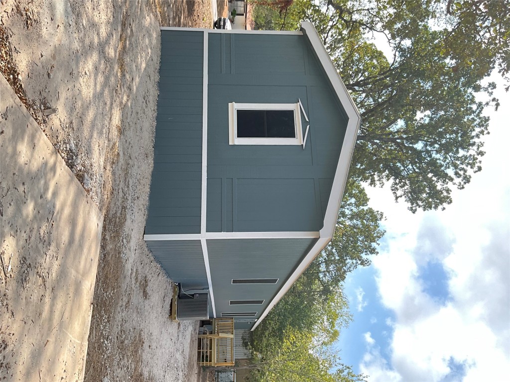 204 Overhill Road Bastrop, TX 78602 - Photo 2 of 18 a house with trees in the background