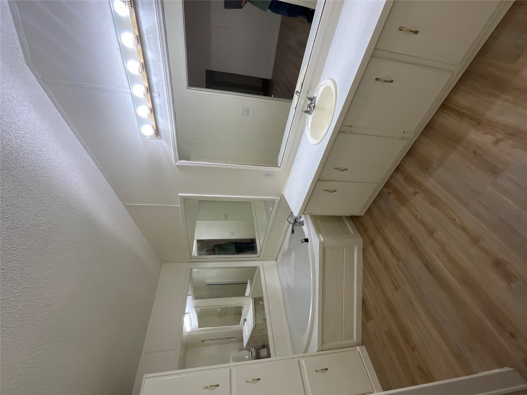 204 Overhill Road Bastrop, TX 78602 - Photo 7 of 18 a large bathroom with a double vanity sink and a mirror