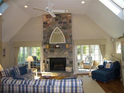 29 Alma Road Mashpee, MA 02649 - Photo 5 of 28 a living room with furniture a fireplace and a chandelier
