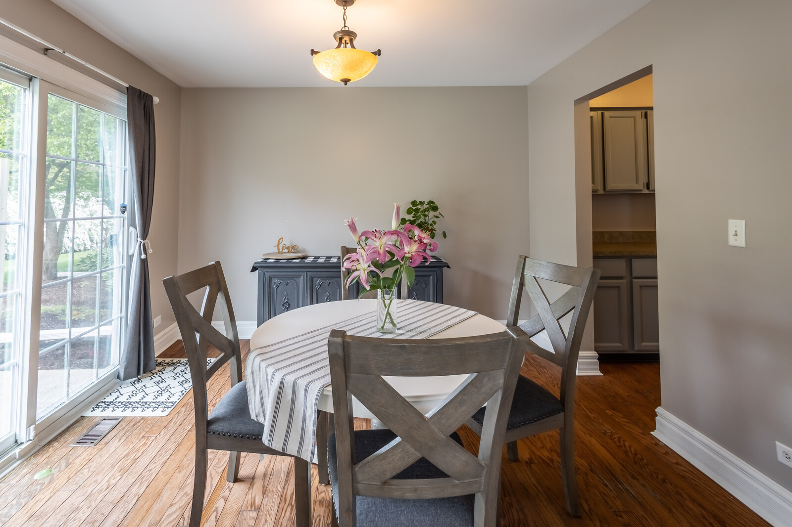 36102 North Springbrook Lane Gurnee, IL 60031 - Photo 11 of 21 a view of a dining room with furniture and wooden floor