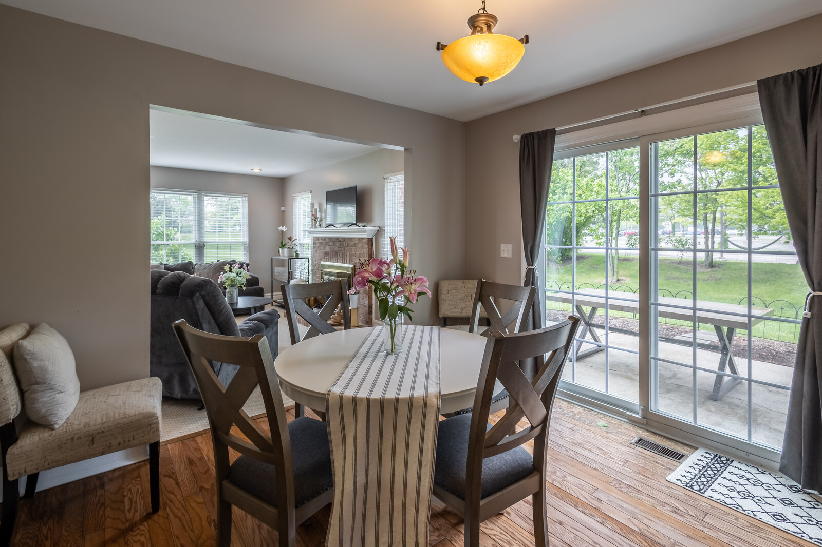 36102 North Springbrook Lane Gurnee, IL 60031 - Photo 12 of 21 a view of a dining room with furniture and wooden floor