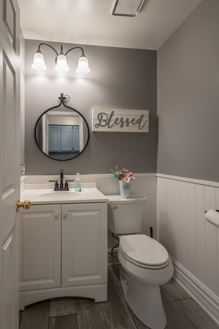 36102 North Springbrook Lane Gurnee, IL 60031 - Photo 13 of 21 a bathroom with a toilet a sink and mirror