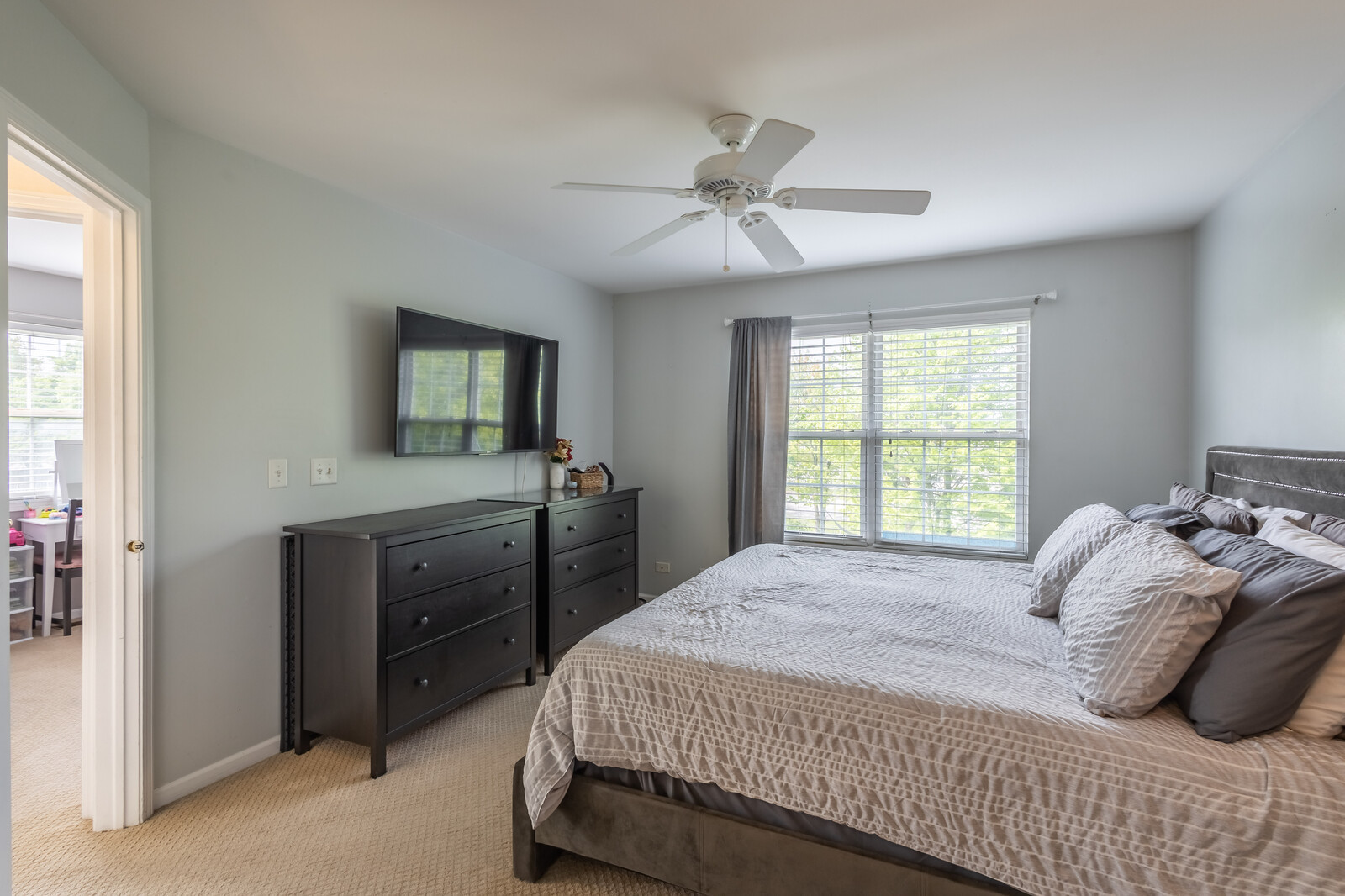 36102 North Springbrook Lane Gurnee, IL 60031 - Photo 15 of 21 a bedroom with a bed and a flat tv screen on dresser