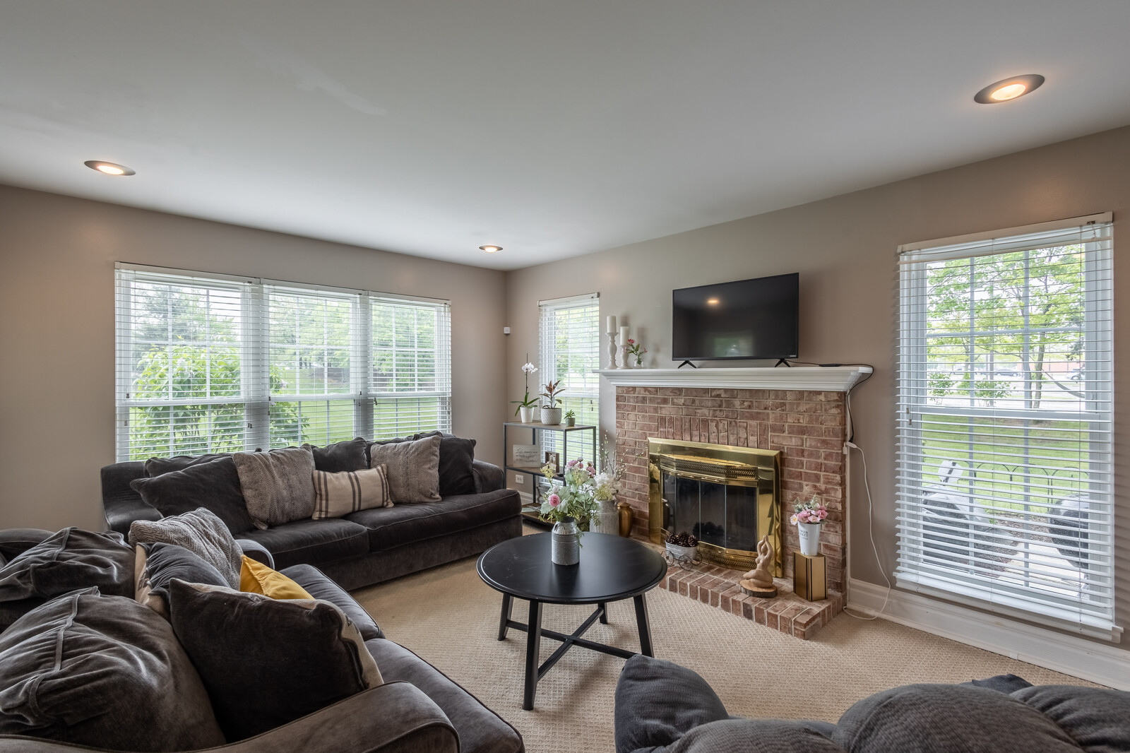 36102 North Springbrook Lane Gurnee, IL 60031 - Photo 4 of 21 a living room with furniture a fireplace and a large window
