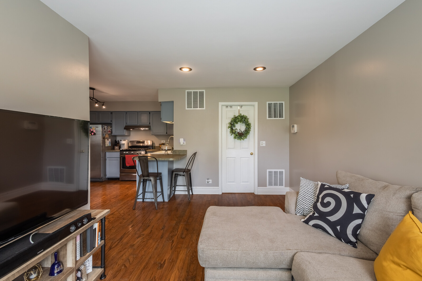 36102 North Springbrook Lane Gurnee, IL 60031 - Photo 6 of 21 a living room with furniture and a flat screen tv