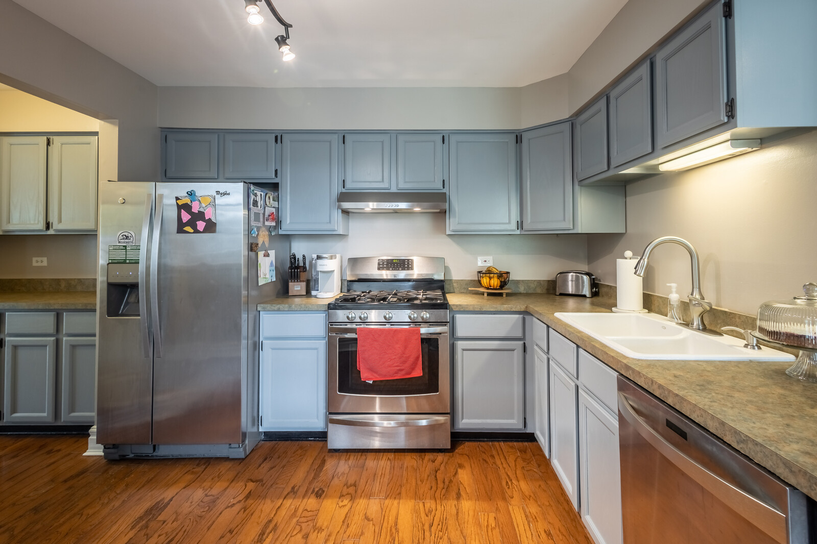 36102 North Springbrook Lane Gurnee, IL 60031 - Photo 7 of 21 a kitchen with stainless steel appliances granite countertop a refrigerator sink and stove