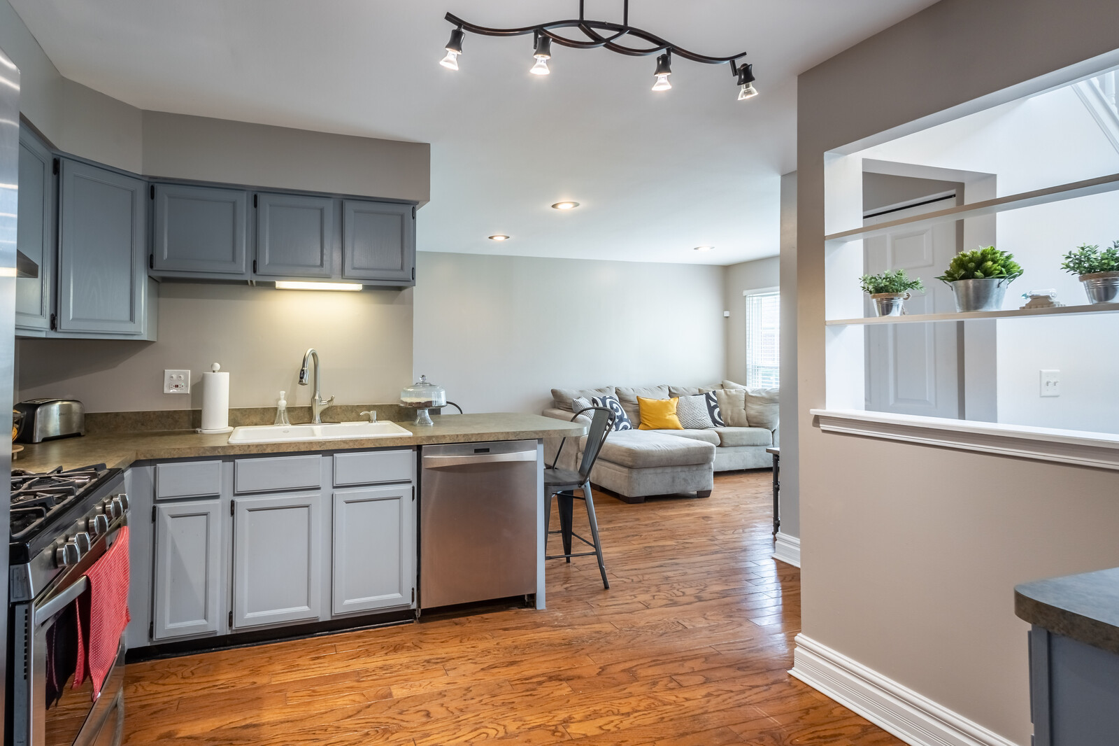 36102 North Springbrook Lane Gurnee, IL 60031 - Photo 9 of 21 a kitchen with stainless steel appliances granite countertop a sink a stove top oven a counter space and cabinets