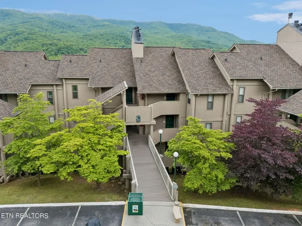 an aerial view of a house with a garden