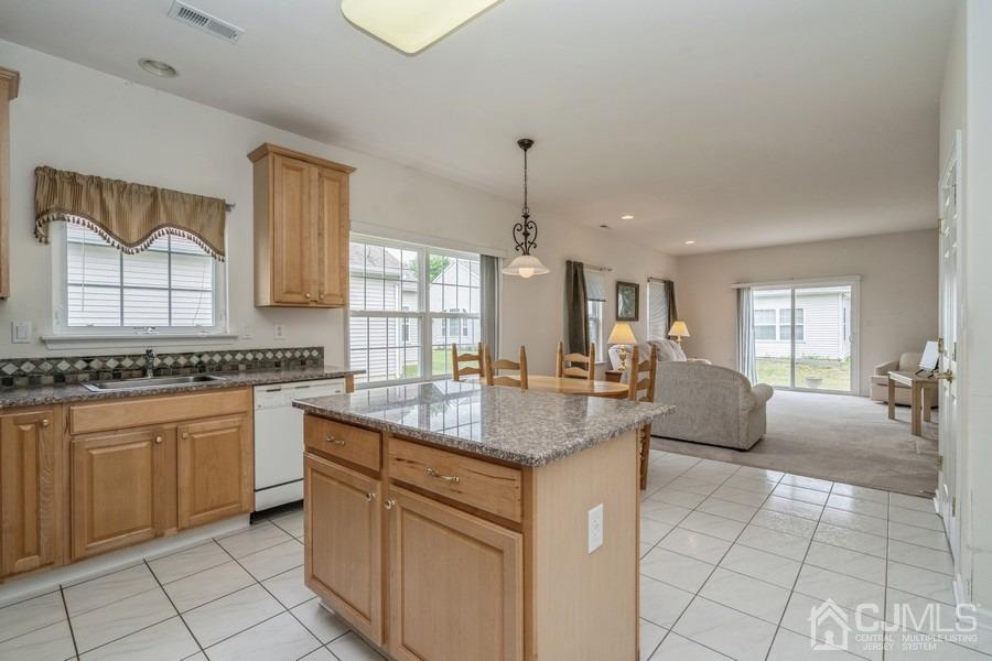 111 San Marco Road Monroe Township, NJ 08831 - Photo 11 of 31 a kitchen with a sink stove and cabinets