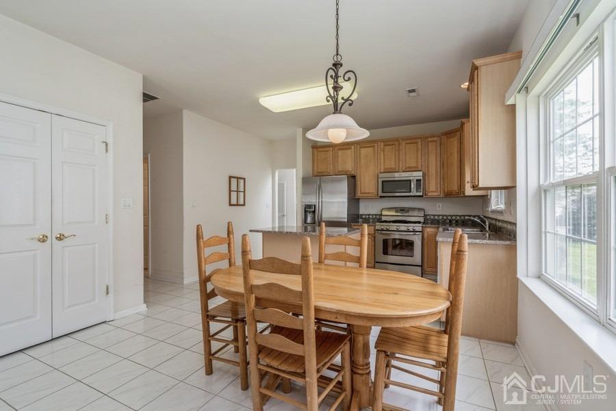 111 San Marco Road Monroe Township, NJ 08831 - Photo 12 of 31 a view of a dining room with furniture window and outside view