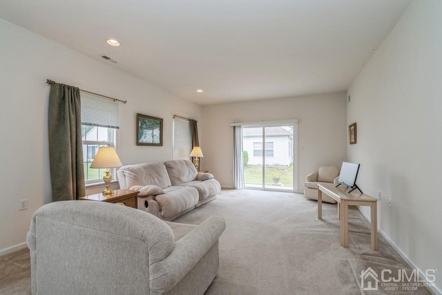 111 San Marco Road Monroe Township, NJ 08831 - Photo 16 of 31 a living room with furniture and a window