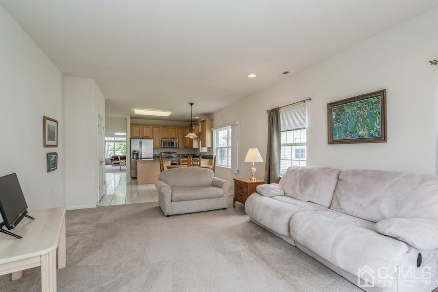 111 San Marco Road Monroe Township, NJ 08831 - Photo 17 of 31 a living room with furniture and a couch