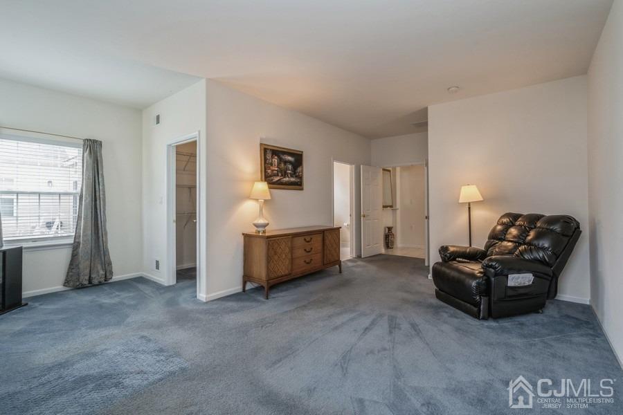 111 San Marco Road Monroe Township, NJ 08831 - Photo 24 of 31 a living room with furniture and a flat screen tv