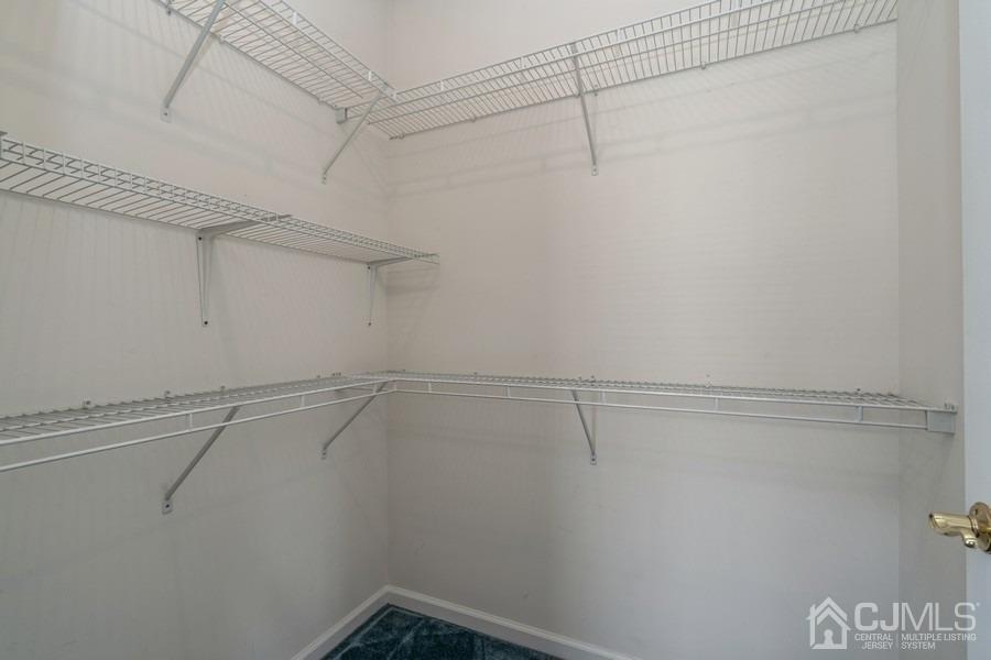 111 San Marco Road Monroe Township, NJ 08831 - Photo 25 of 31 a view of a room with racks on the wall