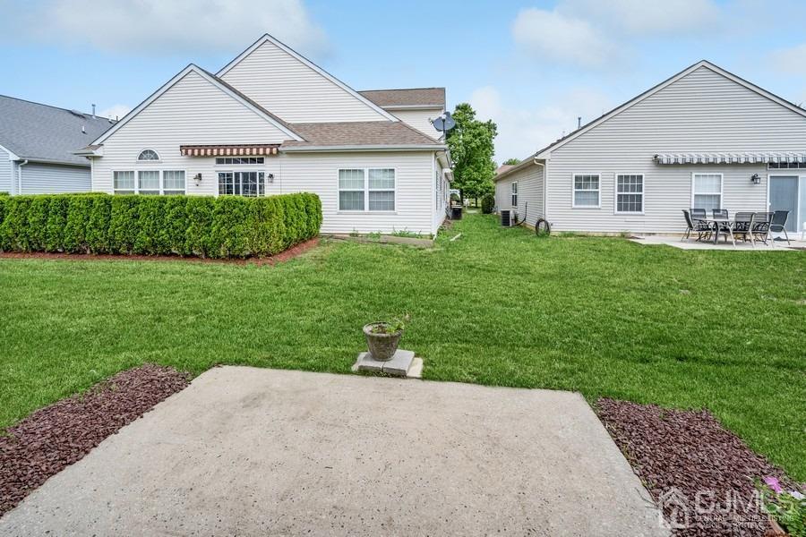111 San Marco Road Monroe Township, NJ 08831 - Photo 28 of 31 a front view of a house with a yard and garage