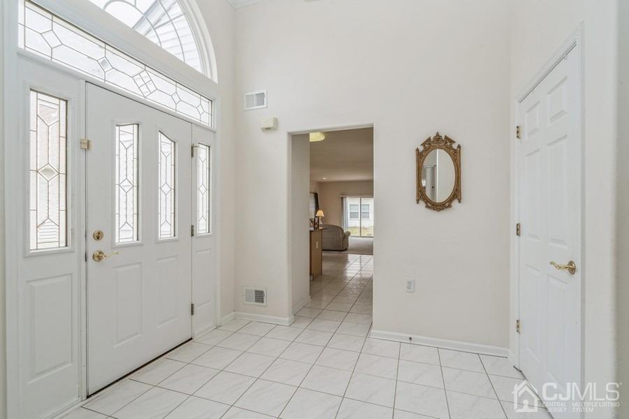 111 San Marco Road Monroe Township, NJ 08831 - Photo 4 of 31 a view of a bathroom from the hallway
