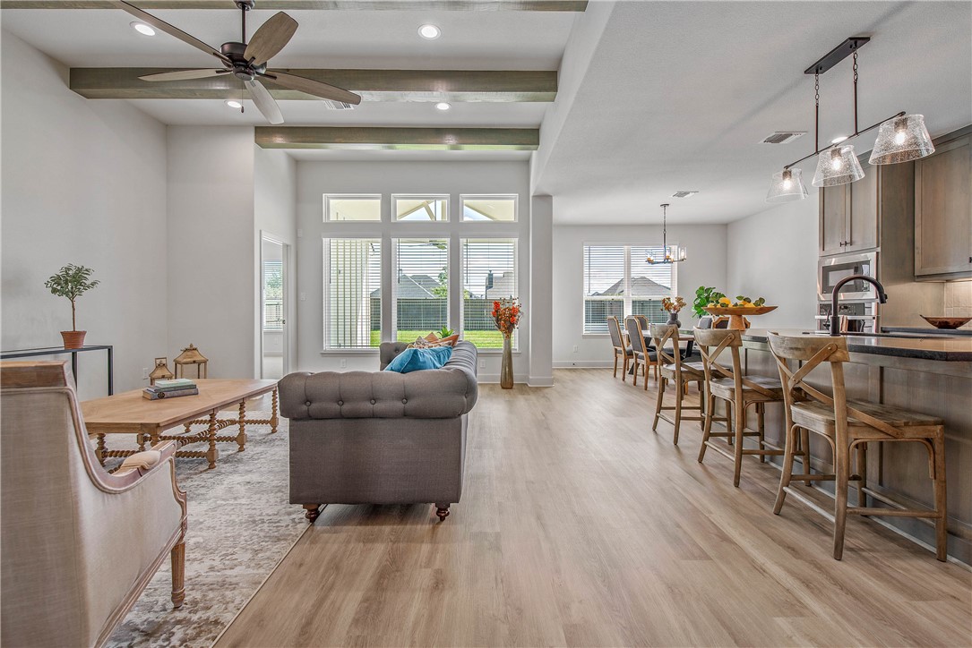 5010 Acadia Loop Bryan, TX 77802 - Photo 10 of 21 a living room with furniture and a wooden floor