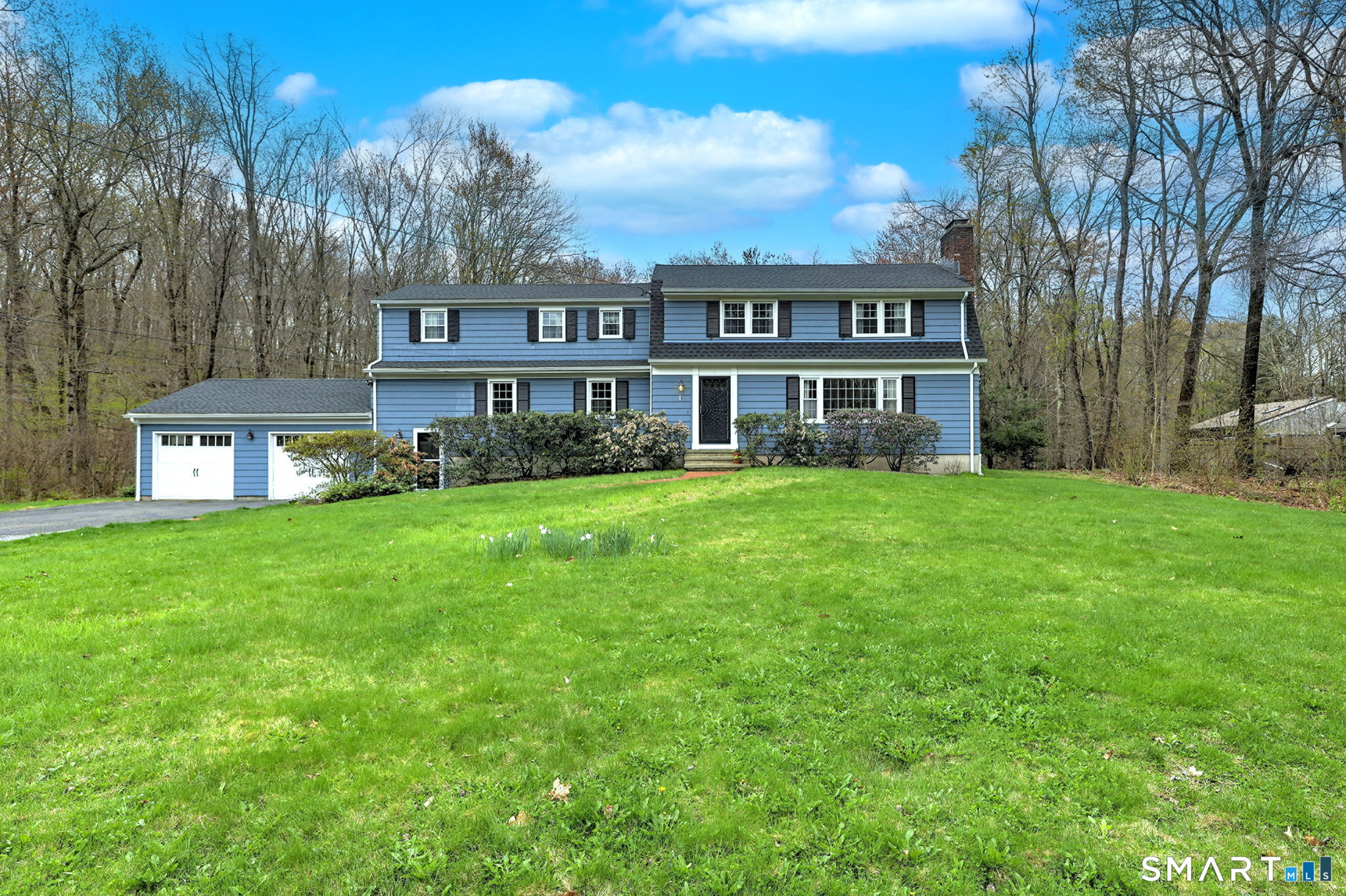 14 Ann Drive Bethany, CT 06524 - Photo 1 of 40 a view of a house next to a big yard and large trees