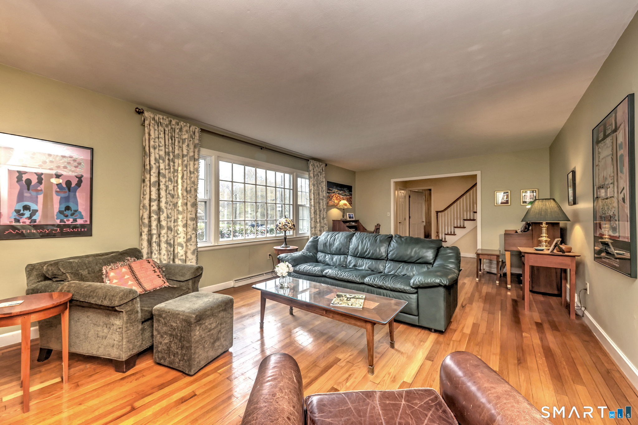 14 Ann Drive Bethany, CT 06524 - Photo 11 of 40 a living room with furniture and a large window