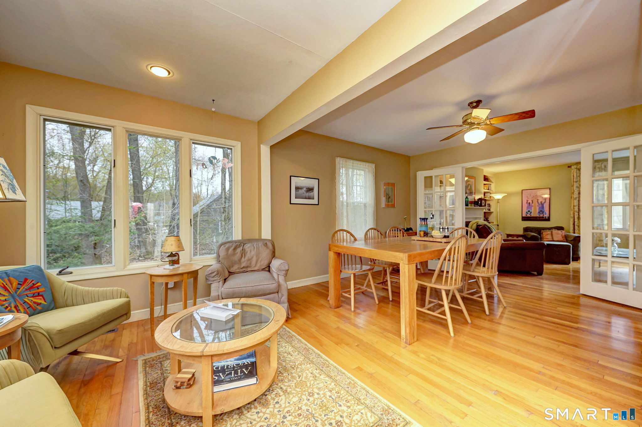 14 Ann Drive Bethany, CT 06524 - Photo 15 of 40 a dining room with furniture a large window and wooden floor