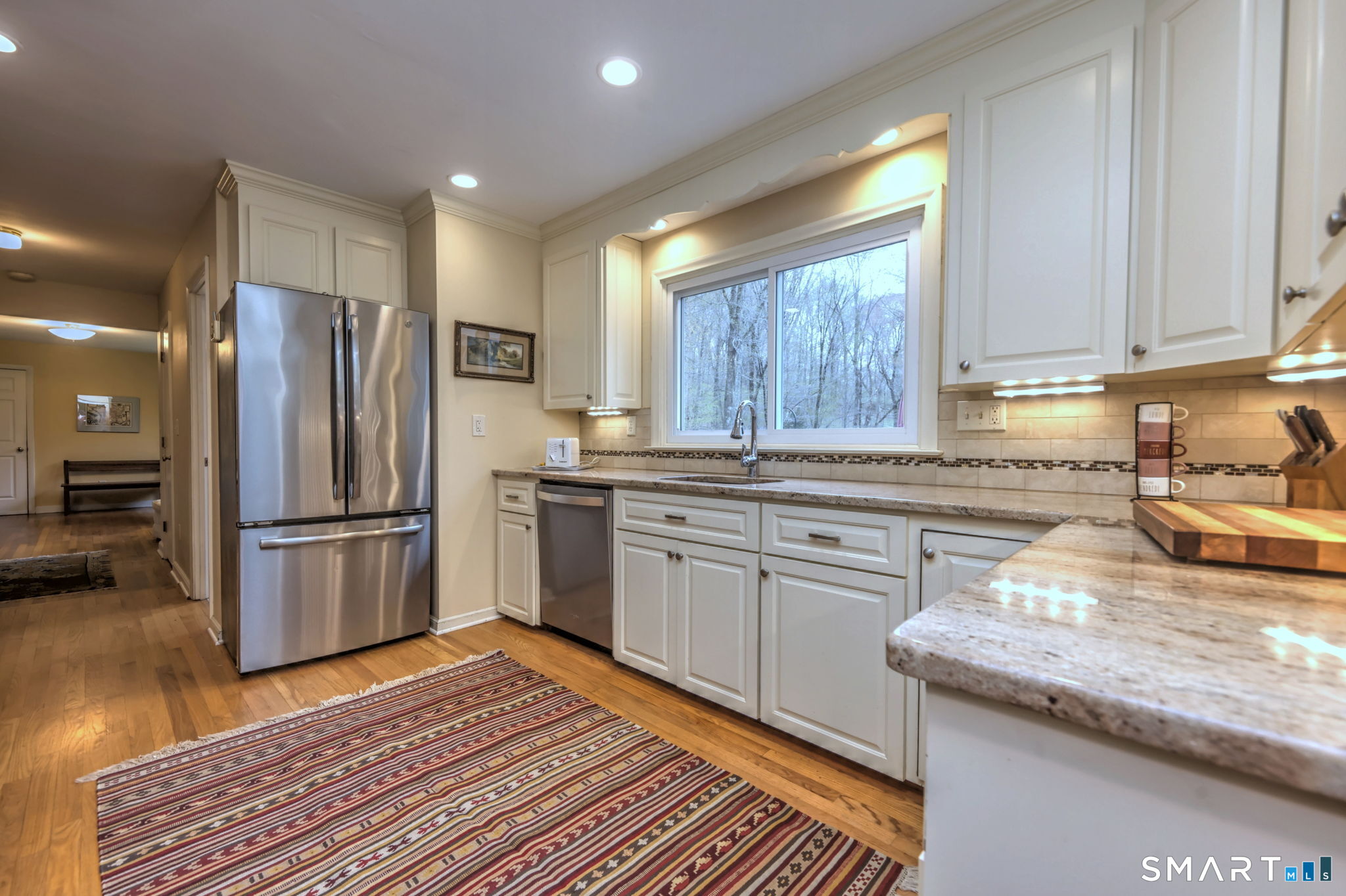 14 Ann Drive Bethany, CT 06524 - Photo 18 of 40 a kitchen with granite countertop stainless steel appliances and wooden cabinets