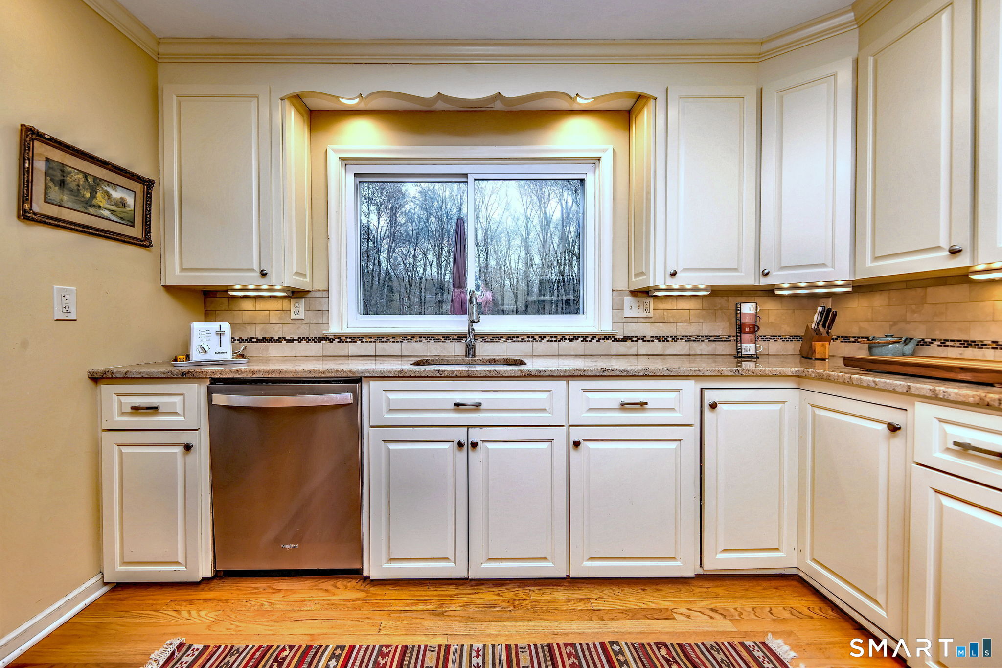 14 Ann Drive Bethany, CT 06524 - Photo 19 of 40 a kitchen with granite countertop white cabinets and white appliances