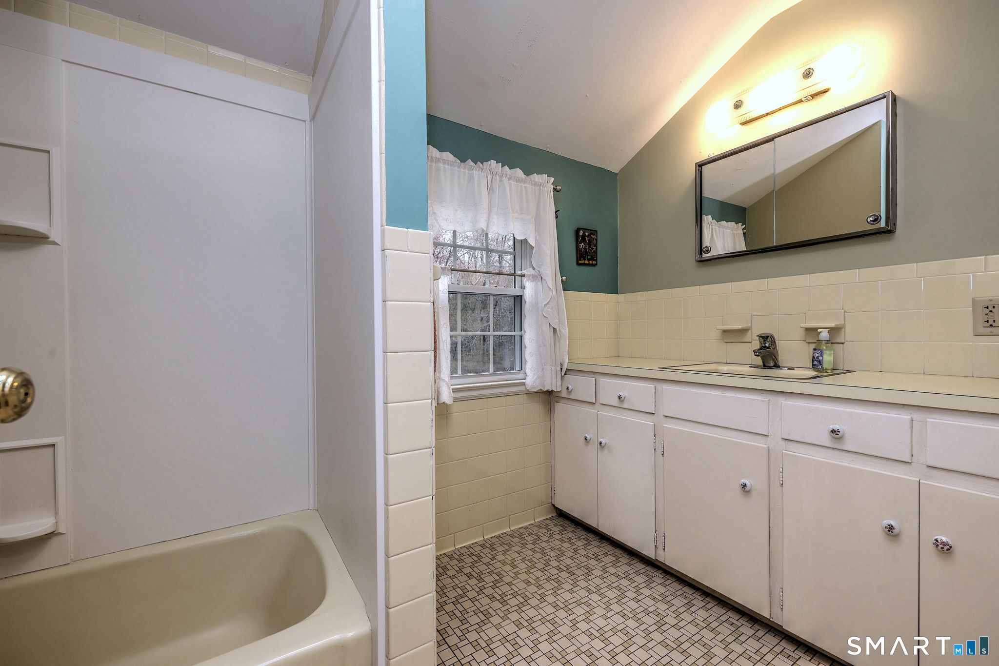 14 Ann Drive Bethany, CT 06524 - Photo 32 of 40 a bathroom with a sink and a bathtub