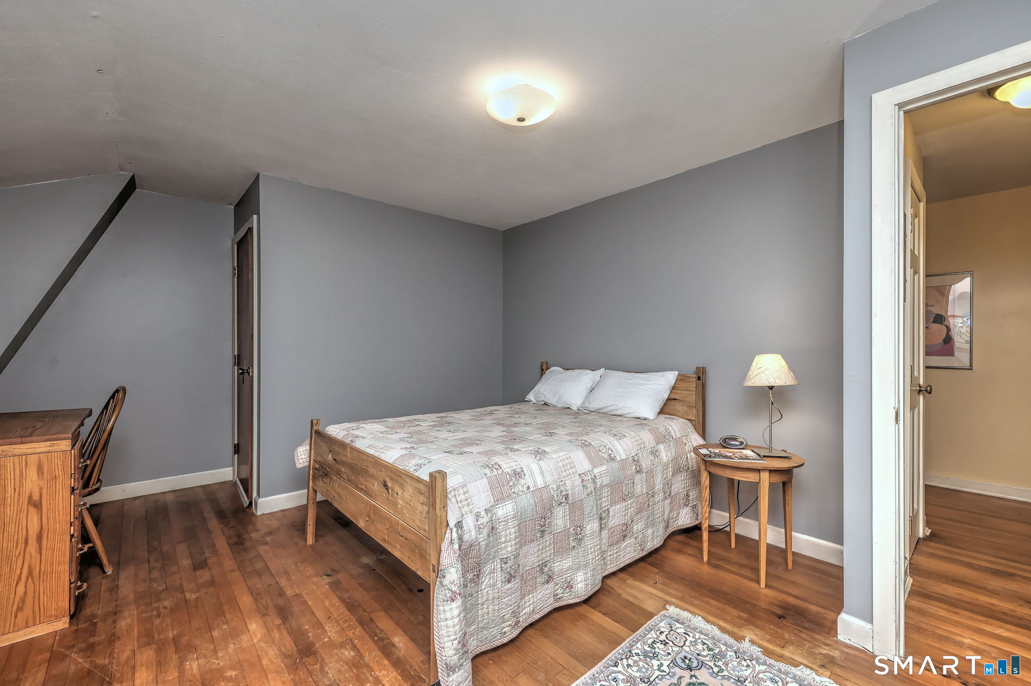 14 Ann Drive Bethany, CT 06524 - Photo 33 of 40 a bedroom with a bed and lamp