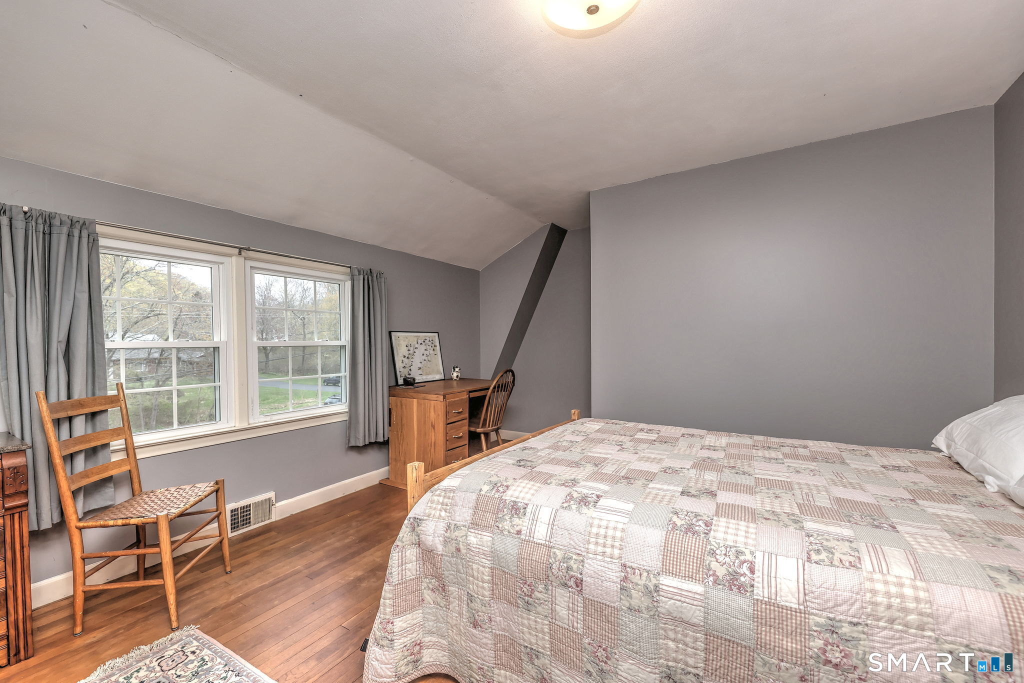 14 Ann Drive Bethany, CT 06524 - Photo 34 of 40 a bedroom with a bed a table and large windows
