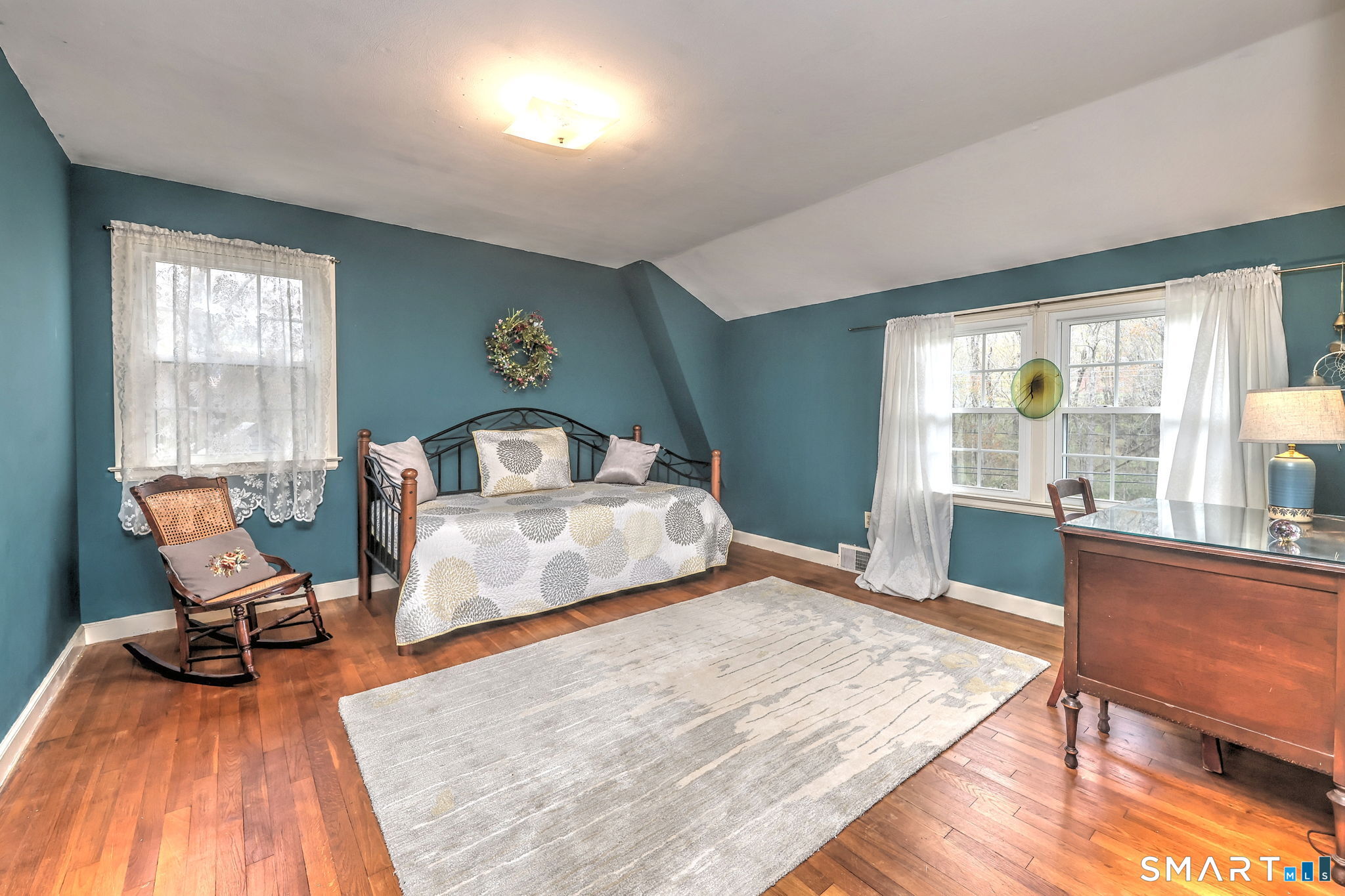 14 Ann Drive Bethany, CT 06524 - Photo 35 of 40 a bedroom with a bed and wooden floor