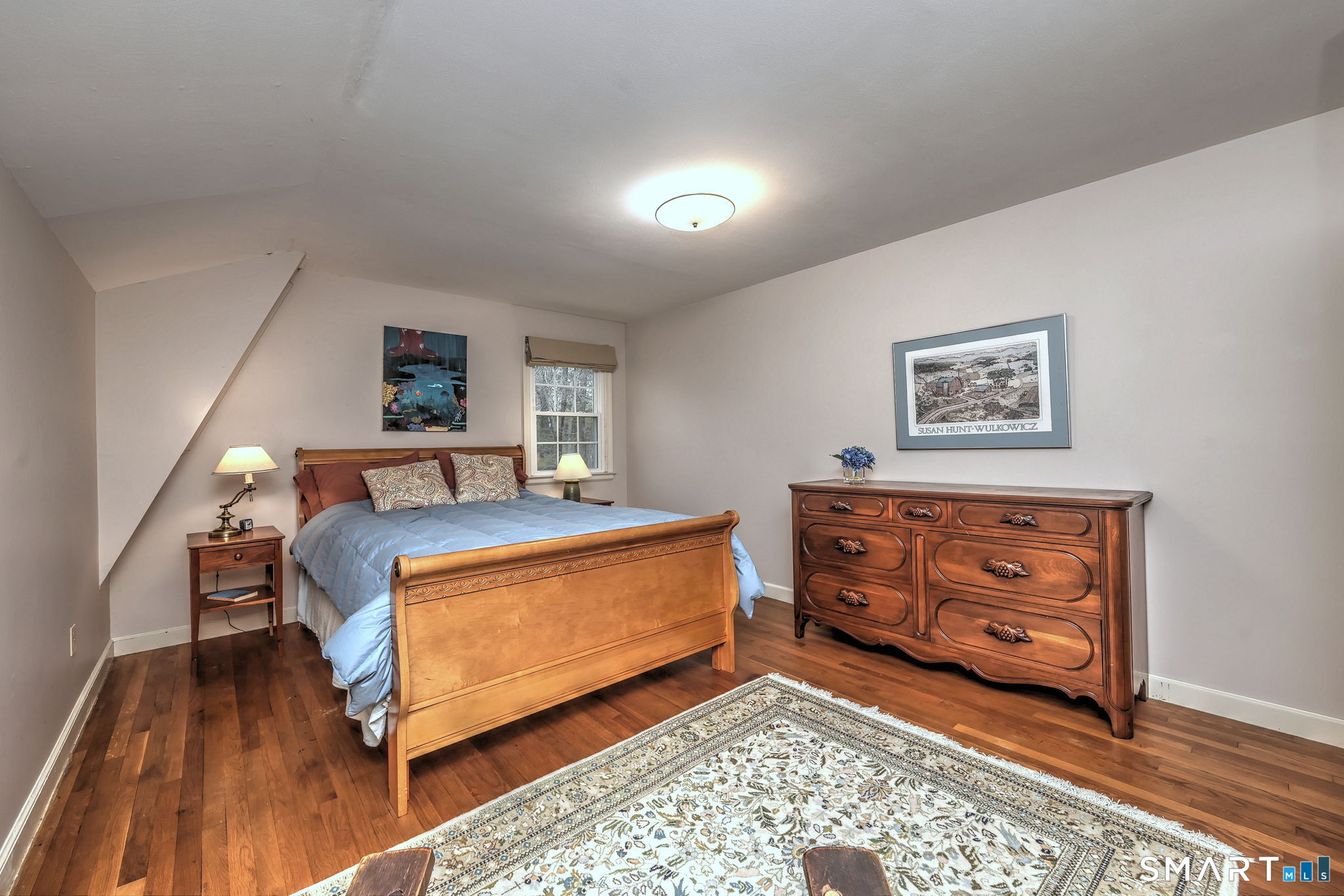 14 Ann Drive Bethany, CT 06524 - Photo 37 of 40 a bedroom with a bed and wooden floor