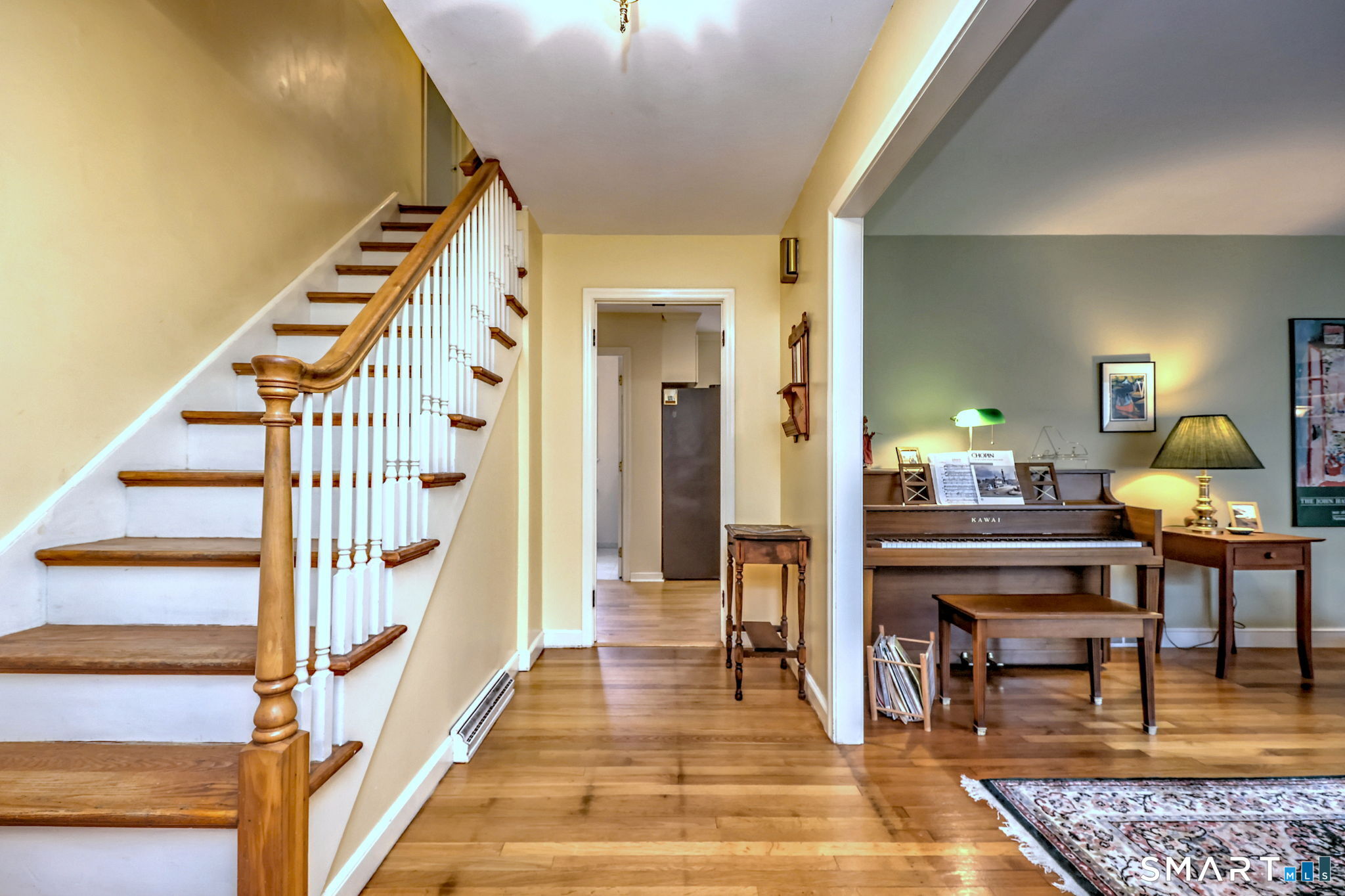 14 Ann Drive Bethany, CT 06524 - Photo 6 of 40 a view of an entryway and livingroom with wooden floor