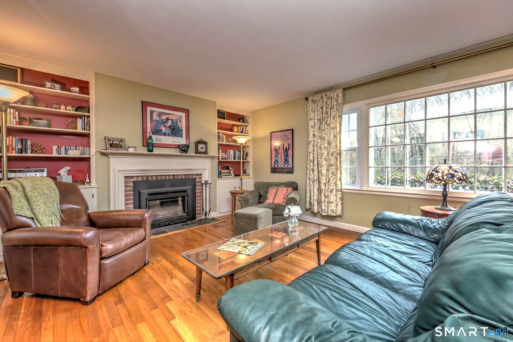 14 Ann Drive Bethany, CT 06524 - Photo 8 of 40 a living room with furniture fireplace and a large window