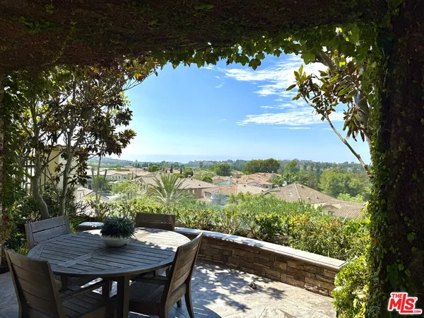 a view of a yard with furniture