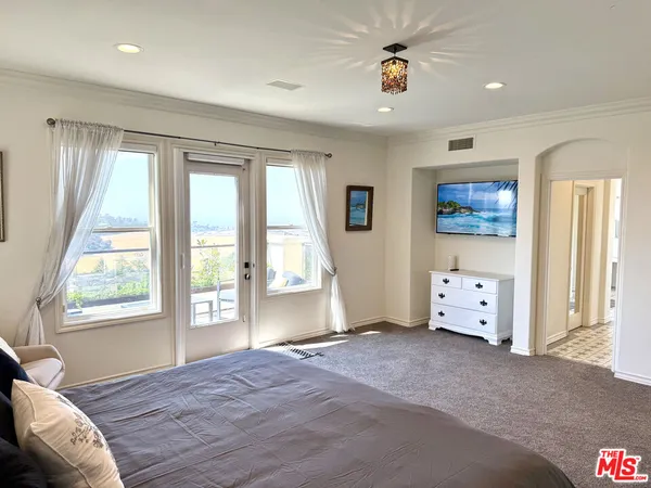 a view of a livingroom with furniture window and wooden floor