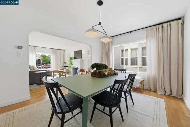 a living room with kitchen island furniture and a table