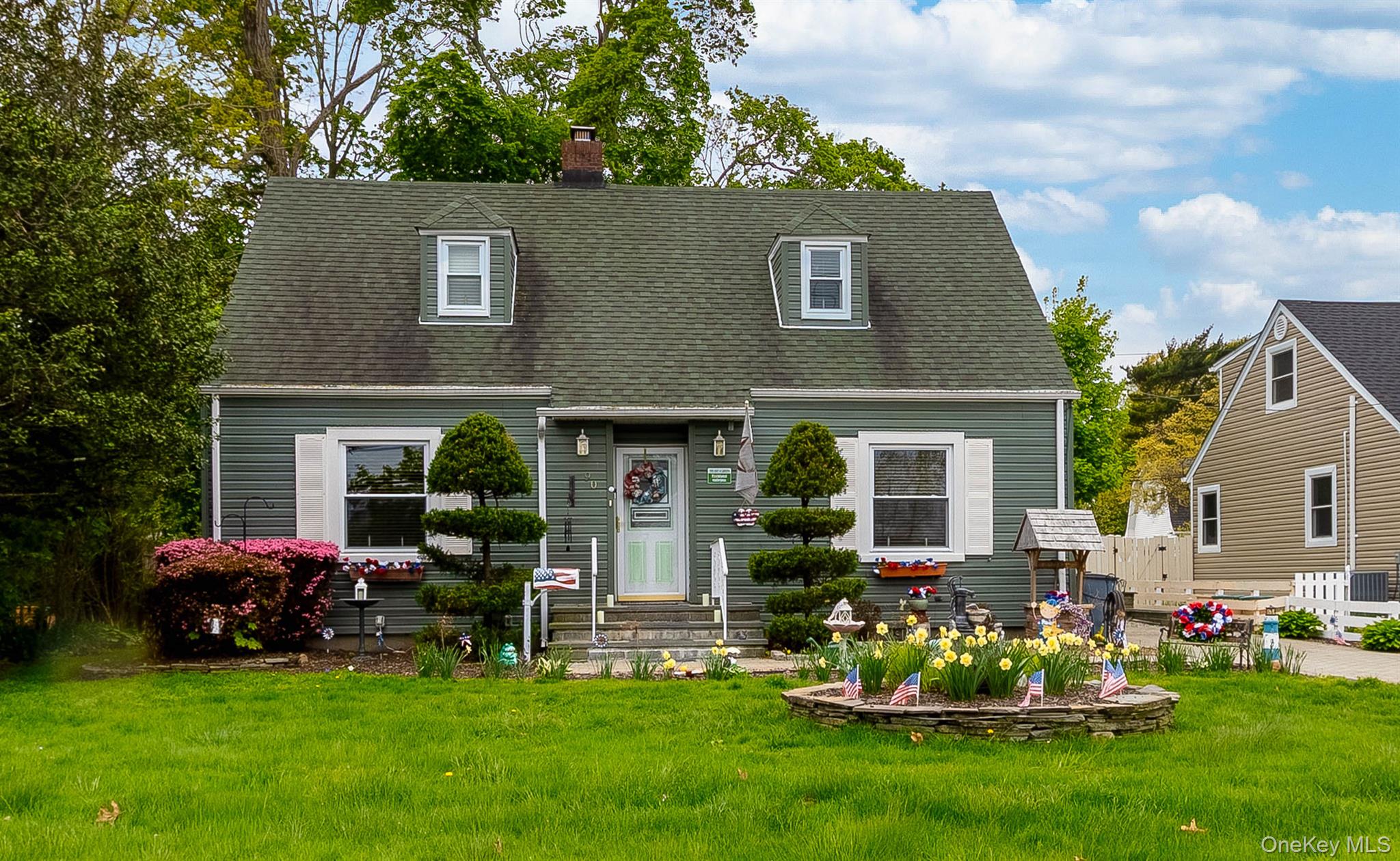 90 Sunset Road Bay Shore, NY 11706 - Photo 1 of 31 Dormer-style residence featuring green siding and a matching shingled roof