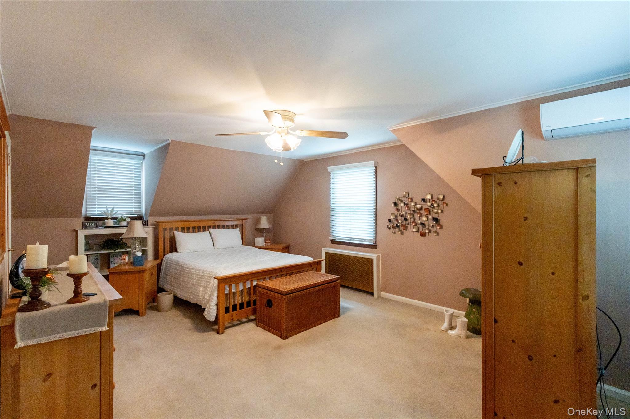 90 Sunset Road Bay Shore, NY 11706 - Photo 29 of 31 Carpeted room with sloped ceilings and a ceiling fan light fixture