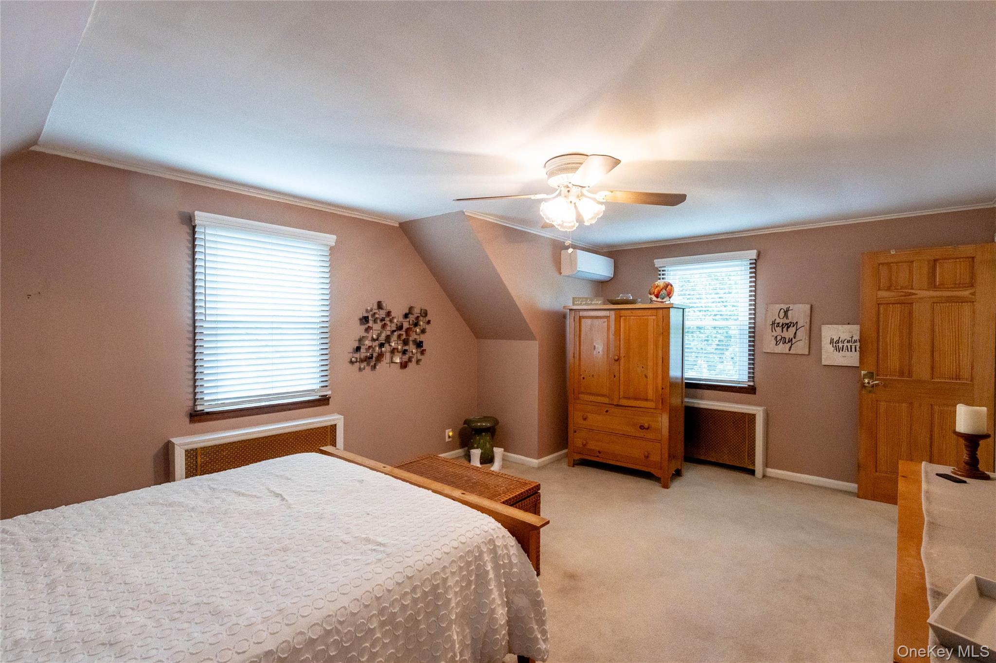90 Sunset Road Bay Shore, NY 11706 - Photo 30 of 31 Carpeted room featuring sloped ceilings and a ceiling fan with integrated lighting
