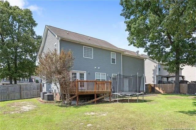 a backyard of a house with yard and seating space