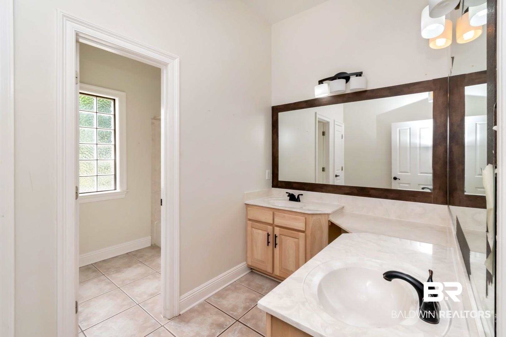 2640 Meadowlake Road Semmes, AL 36575 - Photo 25 of 55 Bathroom featuring vanity and light tile patterned floors